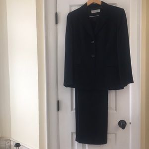Black Tahari suit.